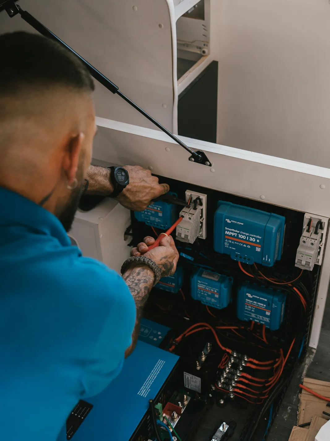 Jon wiring Victron charge controllers and breakers on a caravan powerboard