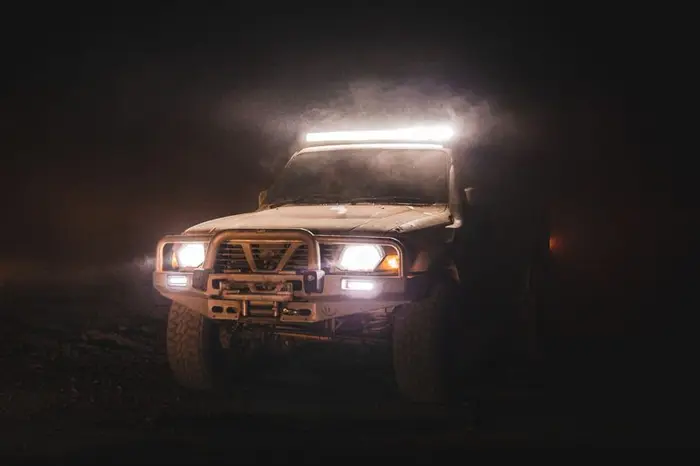 Four wheel drive at night with its light bar lit