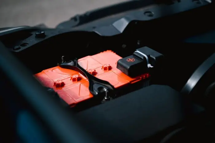 Vehicle battery installed in an engine bay