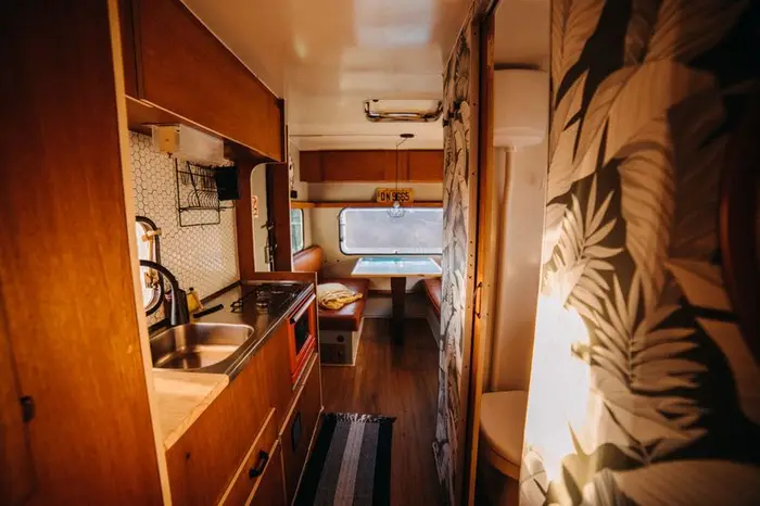 Warm interior lighting in a fitted-out campervan