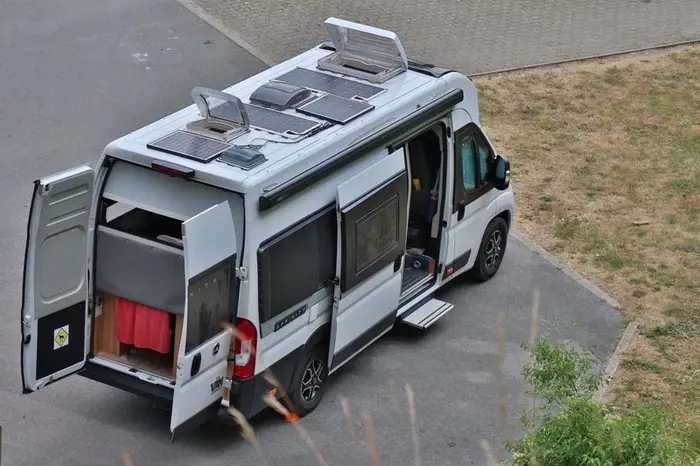 Campervan with solar panels mounted on the roof